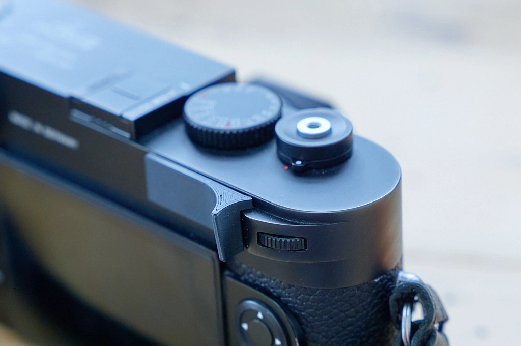 Photo of a thumb grip mounted to a Leica M10 camera