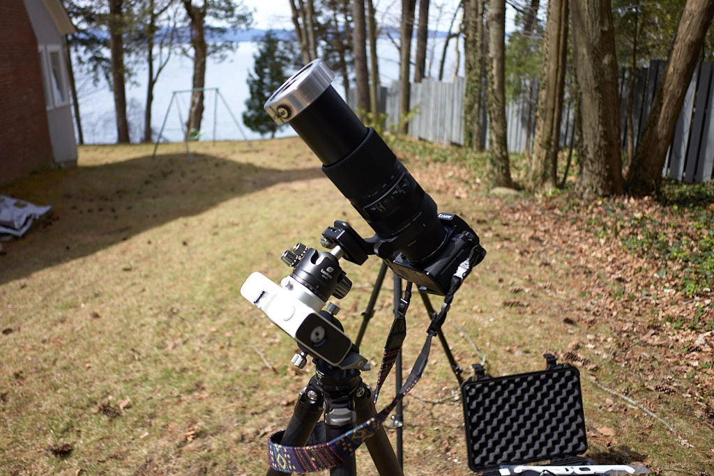 A camera set up on a tracking mount to capture the solar eclipse